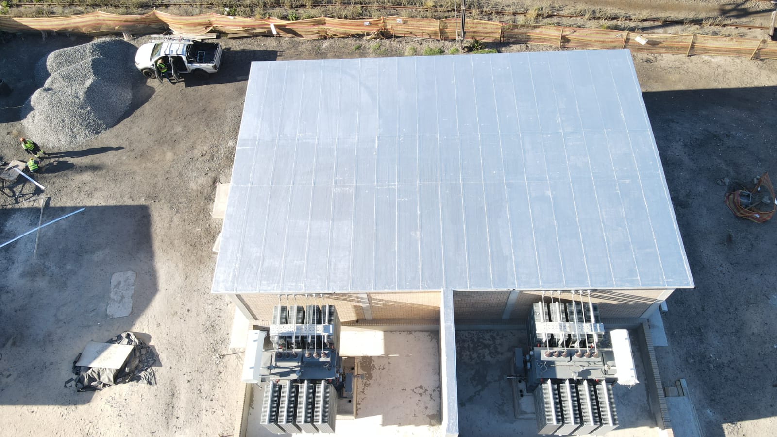 Aerial view of completed Paarden Eiland substation building roof with twin transformers and contractor vehicle on site